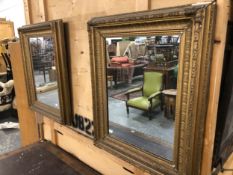 A PAIR OF RECTANGULAR MIRRORS, EACH WITHIN GILT GESSO FRAMES WITH ANTHEMION BANDS IN THE CAVETTOS