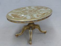 A GREY LACQUERED OVAL BREAKFAST TABLE GILT WITH CHINOISERIE ON THE TOP SUPPORTED ON A TURNED