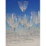 A SET OF SIX AND A PAIR TALLER OF CLEAR GLASS WINES, POSSIBLY ROYAL SCOT, THE BASES OF THE ROUNDED