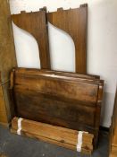 A FRENCH SLEIGH ENDED DOUBLE BED, THE MAHOGANY SIDES WITH DENTIL BASE BANDS CARVED AND APPLIED IN