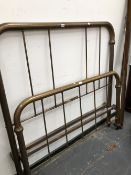 A VINTAGE BRASS DOUBLE BED WITH TUBULAR FRAMED FOOT AND HEAD BOARDS, EACH WITH FIVE UPRIGHT BARS.