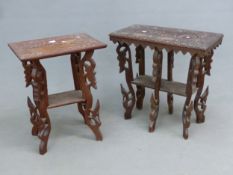 TWO BURMESE RELIEF CARVED HARDWOOD TWO TIER TABLES ON FOLIATE PIERCED AND CARVED LEGS, THE LARGER. W