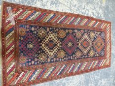 AN ANTIQUE CAUCASIAN KAZAK RUG, 238 X 132cm.