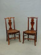 A PAIR OF ANTIQUE COUNTRY MADE ELM AND ASH SOLID SEAT CHAIRS, SHAPED SPLATS, PAD FEET.