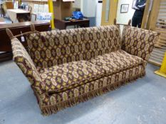 A KNOLE THREE SEAT SETTEE UPHOLSTERED IN TAPESTRY TYPE FABRIC PATTERNED WITH ROWS OF HEXAGONS. W