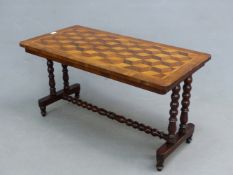 A VICTORIAN PARQUETRY INLAID WALNUT LOW CENTRE TABLE, BOBBIN SUPPORTS. H. 53 x W. 102 x D. 51cms.