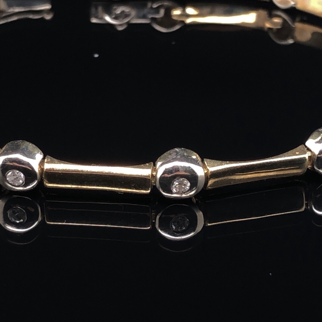 A 9ct YELLOW GOLD AND DIAMOND BAR AND RUB OVER SET BRACELET LENGTH 19.5.cms WEIGHT 11.9gm. - Image 4 of 4