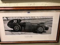 AN EDWARD EVES PHOTOGRAPH OF TONY BROOKS IN HIS VANWALL AT THE 1958 MONACO GRAND PRIX, SIGNED BY THE