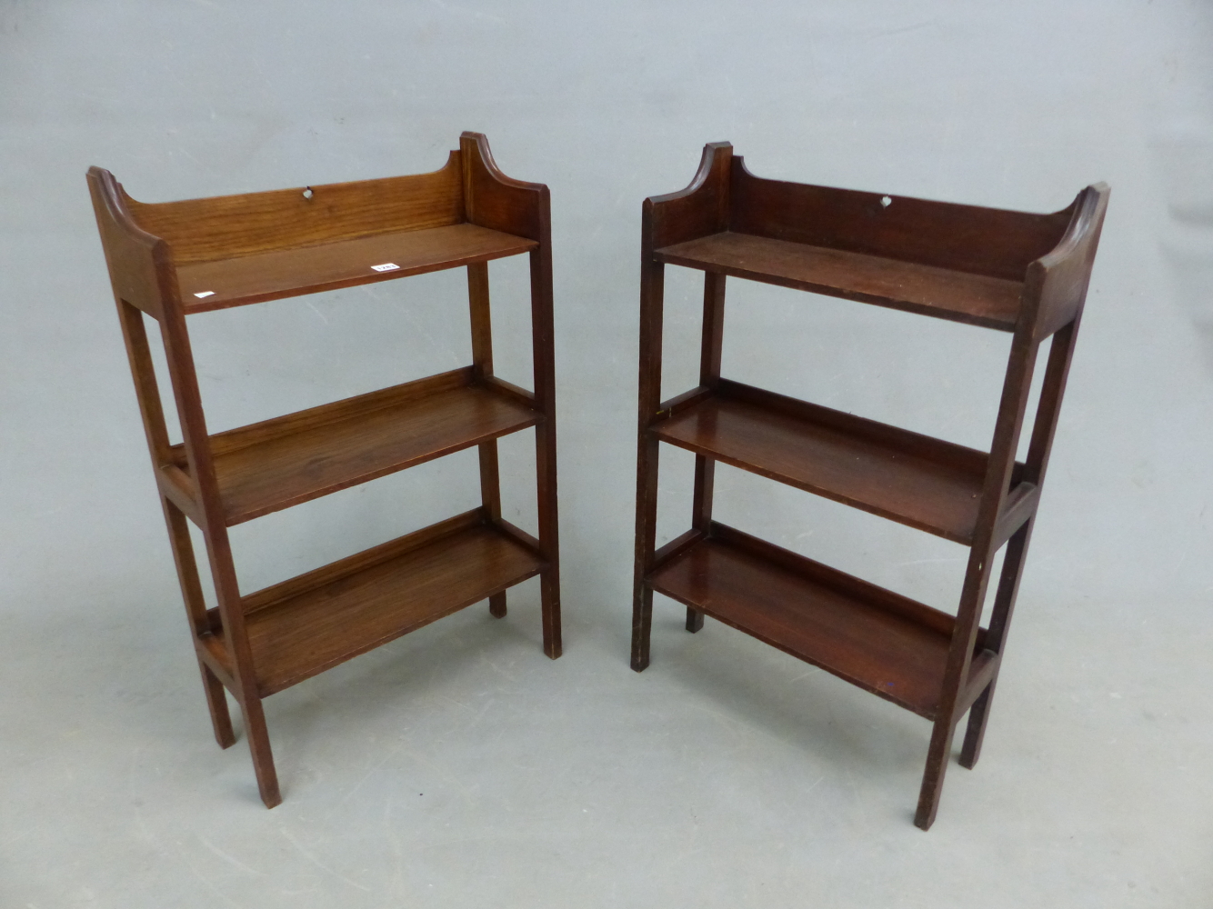 A PAIR OF ARTS AND CRAFTS OAK OPEN BOOK CASES, THREE QUARTER GALLERIES TO THE TOP OF THE THREE