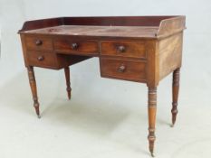 A REGENCY MAHOGANY SIDEBOARD, A THREE QUARTER GALLERY TO THE RECTANGULAR TOP OVER FIVE DRAWERS AND