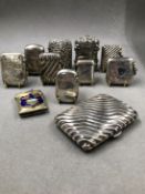 A COLLECTION OF EIGHT HALLMARKED SILVER VESTA CASES, TOGETHER WITH TWO PLATED EXAMPLES, AND A