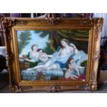 A LARGE DECORATIVE PICTURE OF RECLINING VENUS AND PUTTI, SWEPT GILT FRAME, 90 x 120cms.