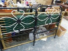 AN ANTIQUE WROUGHT IRON SINGLE BED.