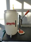 A BREWING BARREL WITH HYDROMETER AND BOTTLER.