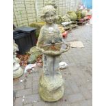 A BIRD BATH IN THE FORM OF A YOUNG GIRL HOLDING A LARGE SEA SHELL.