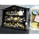 A LARGE COLLECTION OF NOVELTY MINIATURE DESK CLOCKS, A BRASS BOUND COAL BOX, AND A QUANTITY OF BRASS