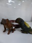 A SPELTER PARROT PIN CUSHION, A SPELTER BULLDOG MATCH STRIKE, AND A MAHOGANY FRAMED BRASS