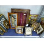 A GROUP OF DECORATIVE FRAMES AND FASHION PRINTS, AND A GLAZED DISPLAY CASE.