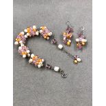 A SILVER, PEARL AND BEAD WORK BRACELET AND EARRING SET.