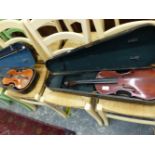 TWO VINTAGE VIOLINS IN CASE.