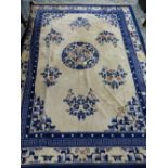 AN ANTIQUE HAND WOVEN CHINESE CARPET