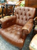 A LAURA ASHLEY LEATHER ARMCHAIR.