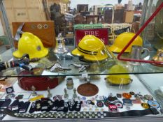 AN EXTENSIVE AND VARIED COLLECTION OF UK FIRE SERVICE RELATED ITEMS INCLUDING HELMETS, HOSES,