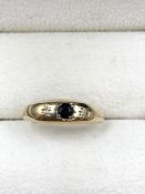 A 9CT GOLD THREE STONE VINTAGE SAPPHIRE AND DIAMOND GYPSY SET BUMP BAND. FINGER SIZE N, WEIGHT 1.