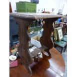 A SMALL CARVED OAK OCCASIONAL TABLE.