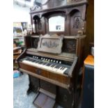 A 19th.C. WALNUT CASED HARMONIUM ORGAN RETAILED BY JOHN MALCOLM, LONDON.