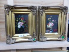 A PAIR OF DECORATIVE STILL LIFE PAINTINGS IN SWEPT GILT FRAMES, SIGNED INDISTINCTLY. 18 x 13cms (