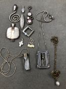 EIGHT VARIOUS SILVER PENDANTS TOGETHER WITH THREE FURTHER SILVER PENDANTS SUSPENDED ON SILVER