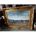 A LARGE DECORATIVE GILT FRAMED PICTURE OF A MILITARY SCENE DEPICTING CAVALRY ON PARADE. 92 x