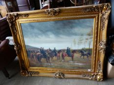 A LARGE DECORATIVE GILT FRAMED PICTURE OF A MILITARY SCENE DEPICTING CAVALRY ON PARADE. 92 x