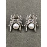 A PAIR OF SILVER, PEARL AND CUBIC ZIRCONIA SPIDER STUD EARRINGS.