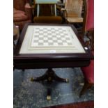 A DECORATIVE CHESS BOARD TABLE.