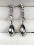 A PAIR OF 9ct WHITE GOLD CUBIC ZIRCONIA DROP EARRINGS. DROP 4cms. WEIGHT 5.2grms.