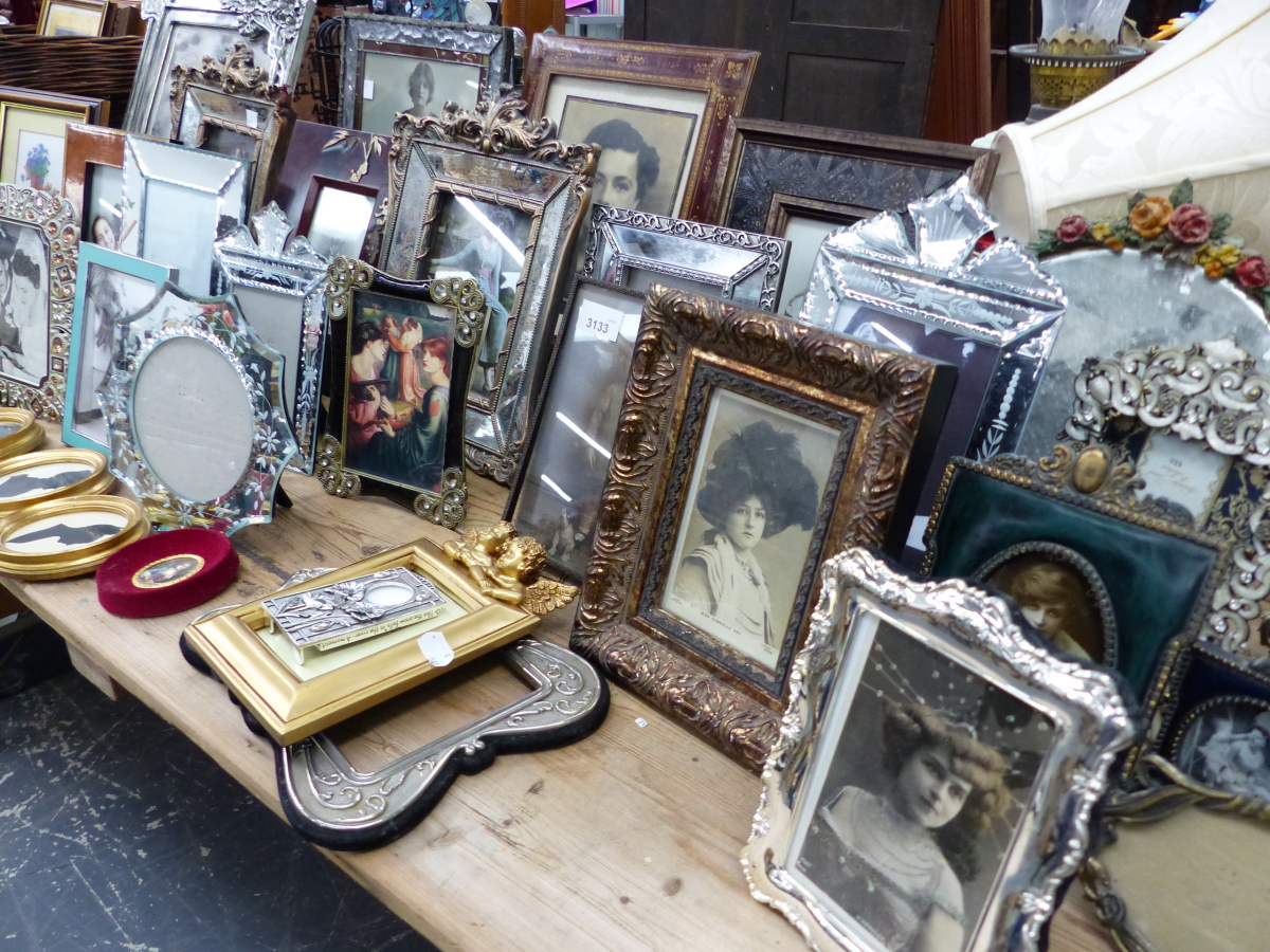 A QUANTITY OF DECORATIVE VINTAGE STYLE PHOTO FRAMES AND MIRRORS ETC.