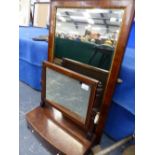 A GEORGE III MAHOGANY DRESSING TABLE MIRROR WITH TWO DRAWER BASE, AND A WALNUT FRAMED WALL MIRROR.