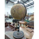 A PRINTED CLOTH GLOBE ON METAL STAND.