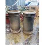 A PAIR OF LARGE CHIMNEY POTS.