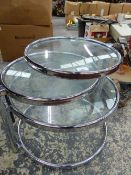 A CHROME AND GLASS RETRO FOUR TIER TABLE.