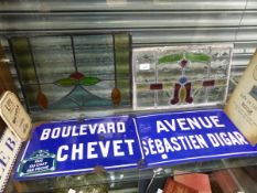 TWO FRENCH ROADSIGNS, TWO STAINED GLASS WINDOW PANELS, ORNAMENTAL SIGNS ETC.