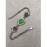A PERSIAN STYLE GEMSET AND SILVER BRACELET. LENGTH 18.5cms, WEIGHT 8.5grms.