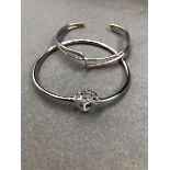 TWO SILVER BANGLES. A STONE SET HEART BANGLE AND A CUFF BANGLE. GROSS WEIGHT 21.5grms.