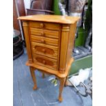 A FLOOR STANDING JEWELLERY CABINET.