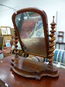 A VICTORIAN MAHOGANY SWING MIRROR.