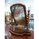 A VICTORIAN MAHOGANY SWING MIRROR.