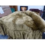A SCULPTED VELVET BED COVER AND BOLSTER, APPROX 210cm DIAMETER AND 65cm FRINGE.