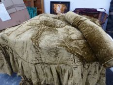 A SCULPTED VELVET BED COVER AND BOLSTER, APPROX 210cm DIAMETER AND 65cm FRINGE.